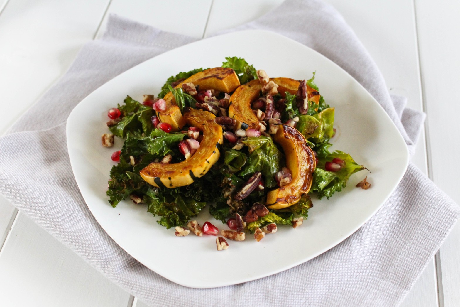 Warm Kale Salad with Delicata Squash and Pomegranate via RDelicious Kitchen @rdkitchen