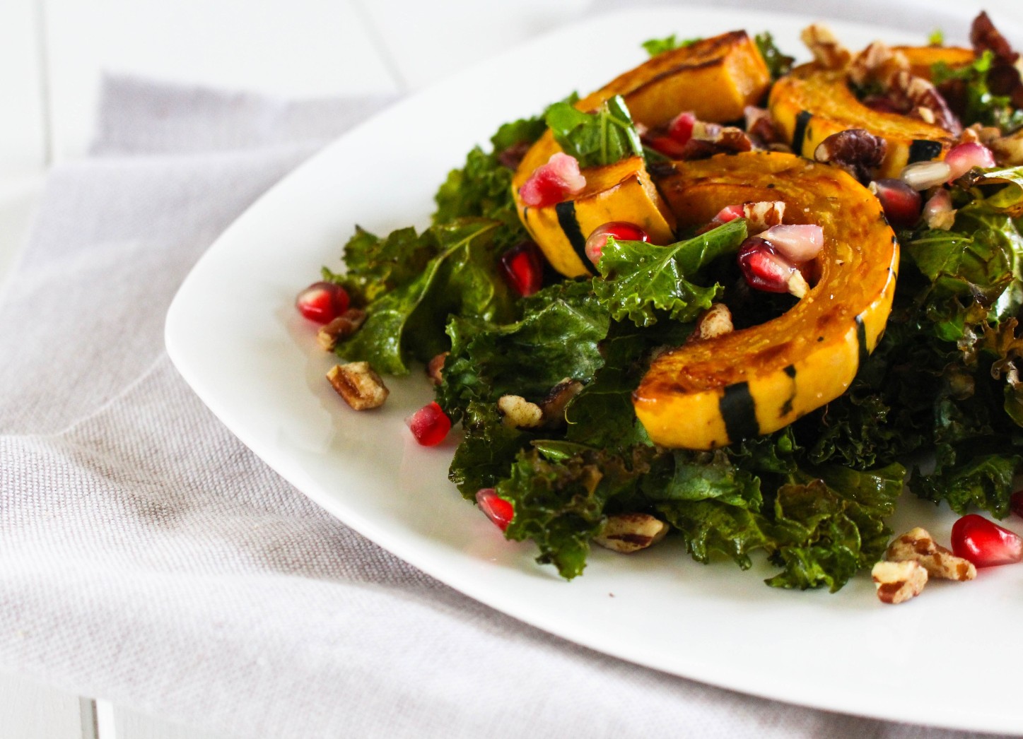 Warm Kale Salad with Delicata Squash and Pomegranate via RDelicious Kitchen @rdkitchen