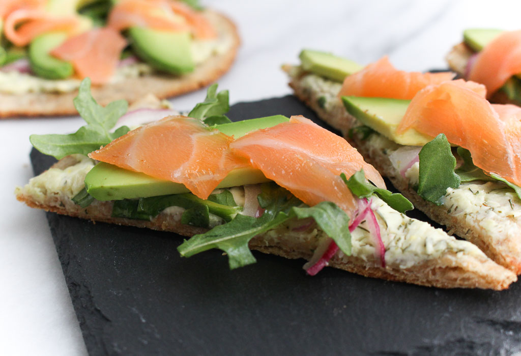 Smoked Salmon Avocado Flatbread - Looking to switch up the same old appetizer recipes you serve at parties or gatherings? Kick off your next party with Smoked Salmon Avocado Flatbreads your guests will love. - via RDelicious Kitchen @RD_Kitchen