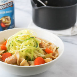 chicken zoodle soup in a white bowl